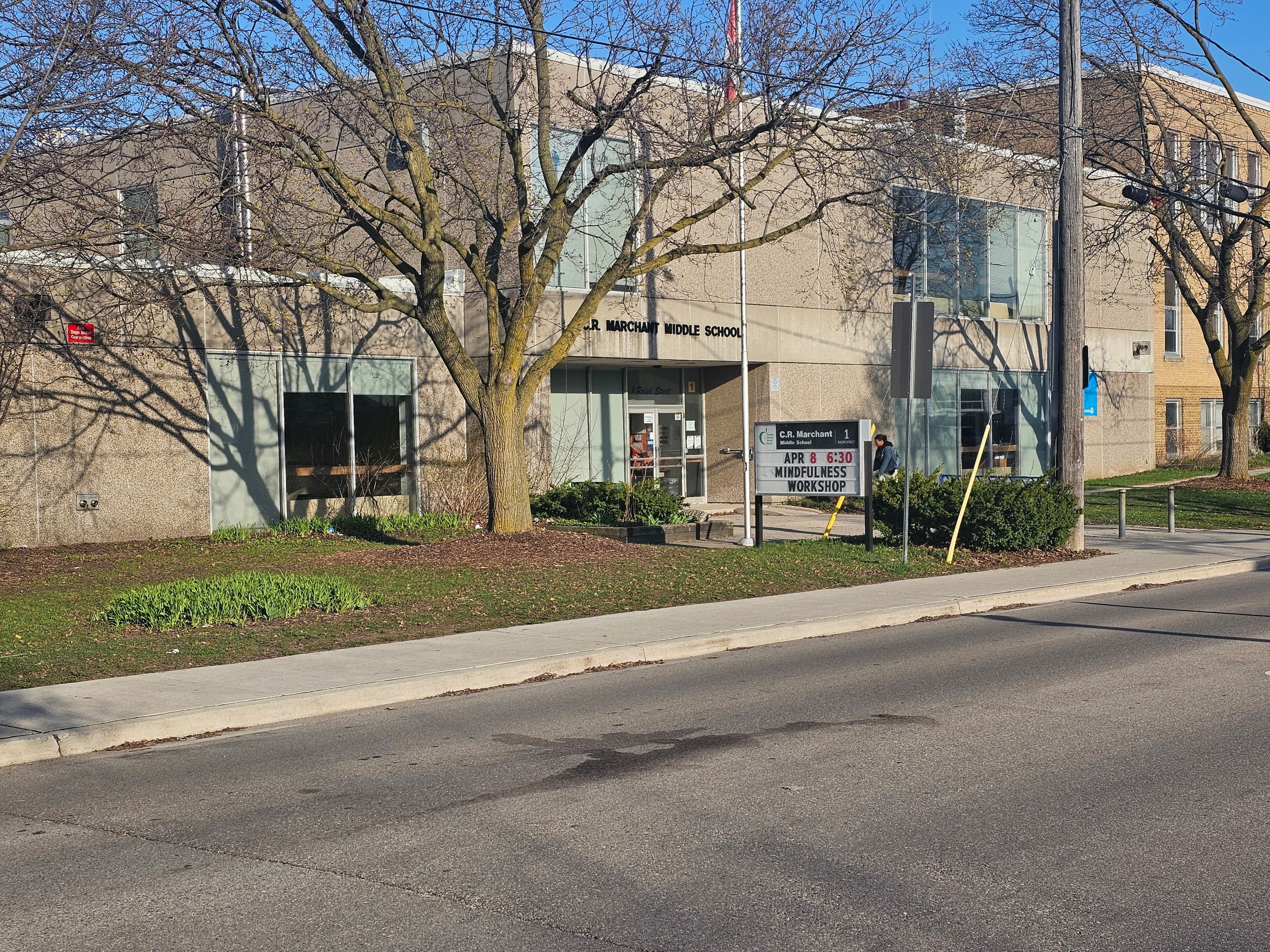 Exterior view of C.R. Marchant Middle School with the school entrance sign