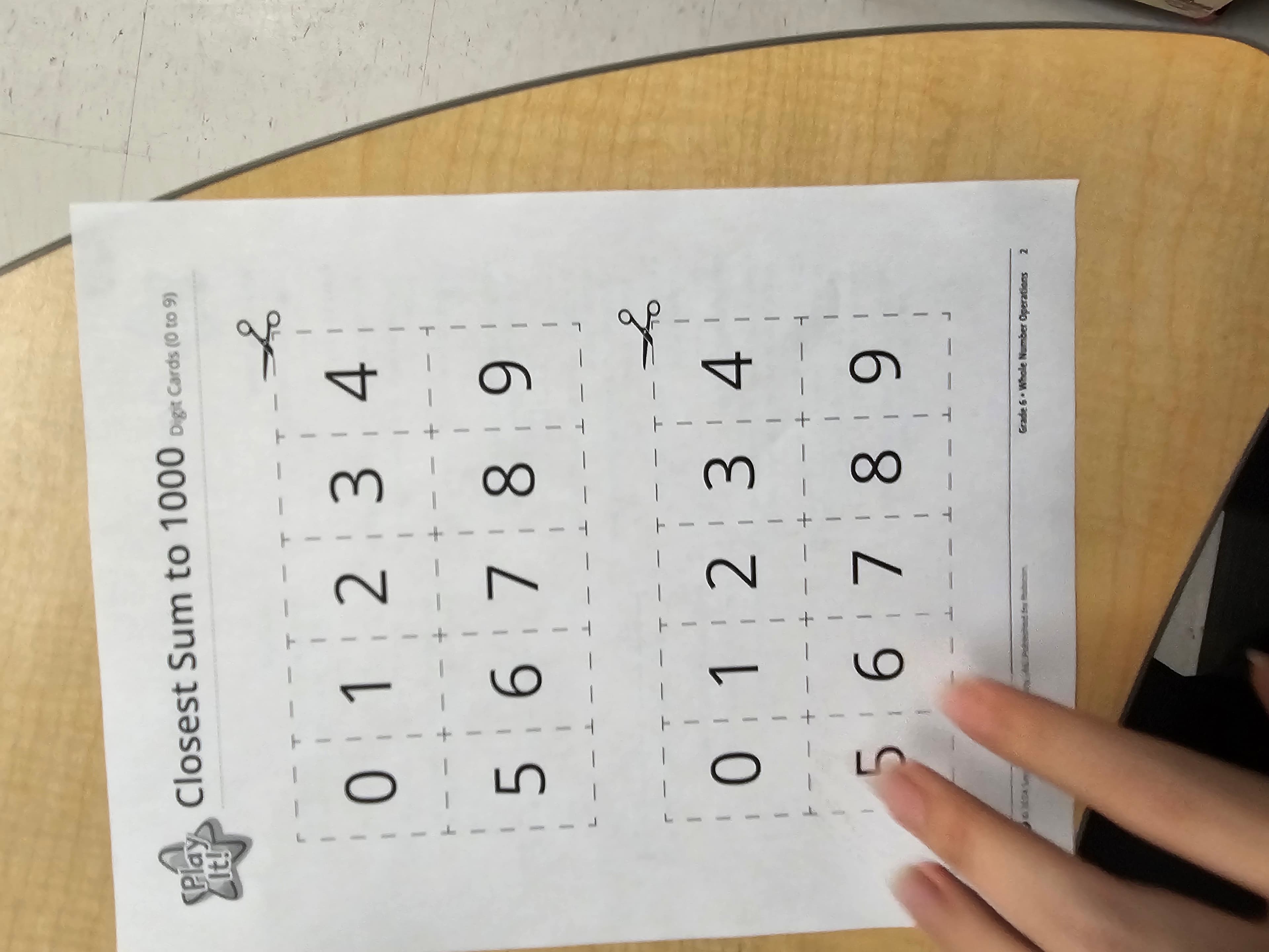 Grade 6 whole number operations digit card activity sheet used for a mathematics game at Rouge Park Public School